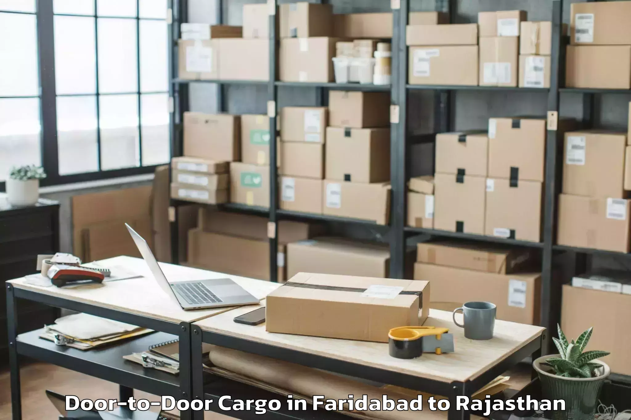 Get Faridabad to Sangam University Bhilwara Door To Door Cargo